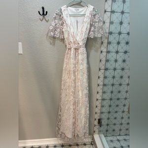 Beautiful cherry blossom dress. Never worn and unaltered.